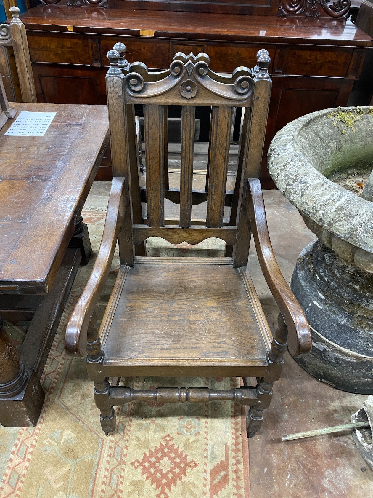 A set of eight 18th century style oak wood seat dining chairs two with arms